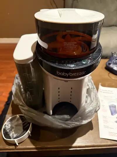 In great shape. Small tripod container is used to store 3 feedings of powdered formula for travel. C...