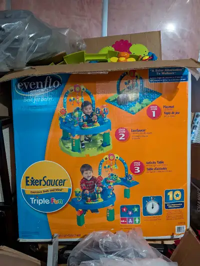 This is an Evenflo ExerSaucer Triple Fun activity centre that grows with your baby through three sta...