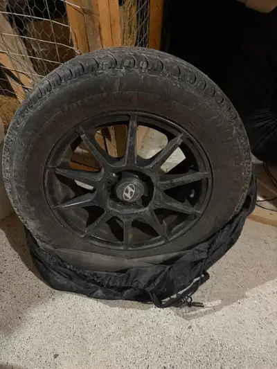 Used for half a season, comes with lug nuts and tire covers. Tire size is in the pictures. 185/65 R1...