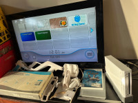 Nintendo Wii w/ accessories and 32” LG TV