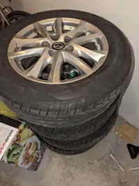 Tires/pneux 215 60 R16 with mazda mags