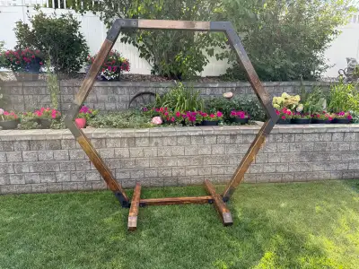 Stunning wooden wedding arch with custom metal brackets. It does fully come apart for transport/stor...