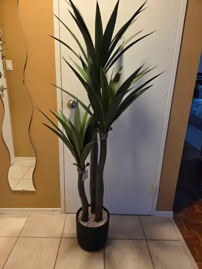 Add a touch of the tropics to your home with this Bouclair 53" artificial tropical tree in a black p...