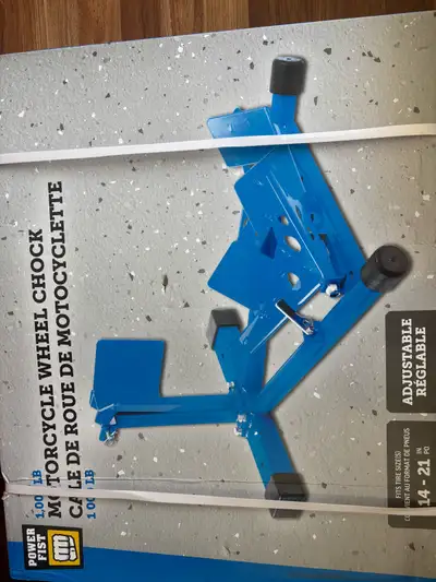 I'm selling a brand new Powerfist 1,000 lbs motorcycle wheel chock, designed to securely hold your m...