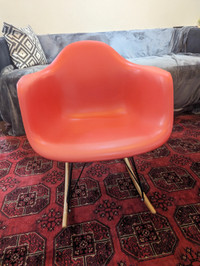 Red eames style rocking chair