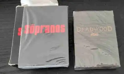 Up for sale are two rare, factory-sealed promotional playing card decks from the golden age of HBO....