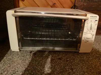 Very clean and efficient toaster oven. Works great. Will fit a small pizza . Not used often. Moving...