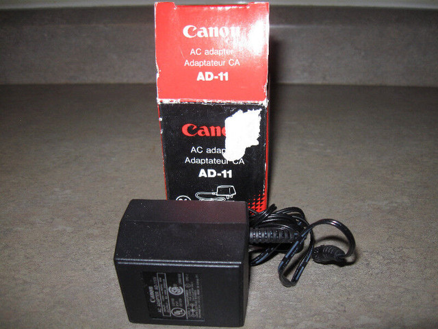 Canon Adaptor-AD-11- in box-120V + bonus in General Electronics in City of Halifax
