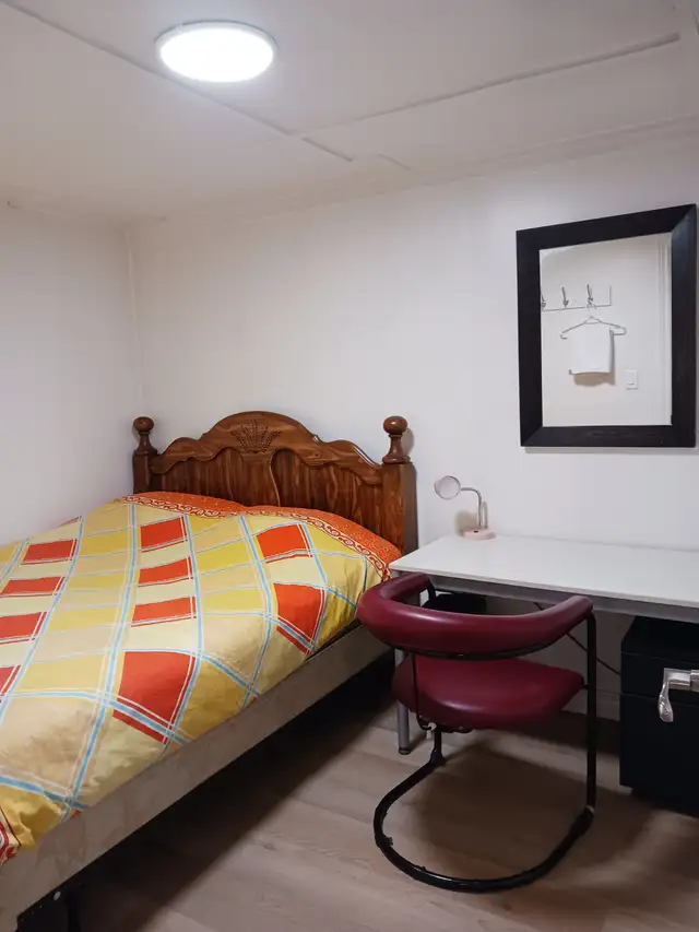 A brand new private day room with a queen-size bed