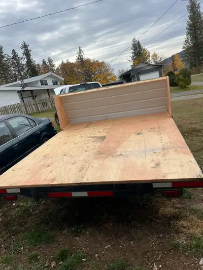 Flat deck sled trailer ,,has papers all new wood, new plug ,greased and ready to roll