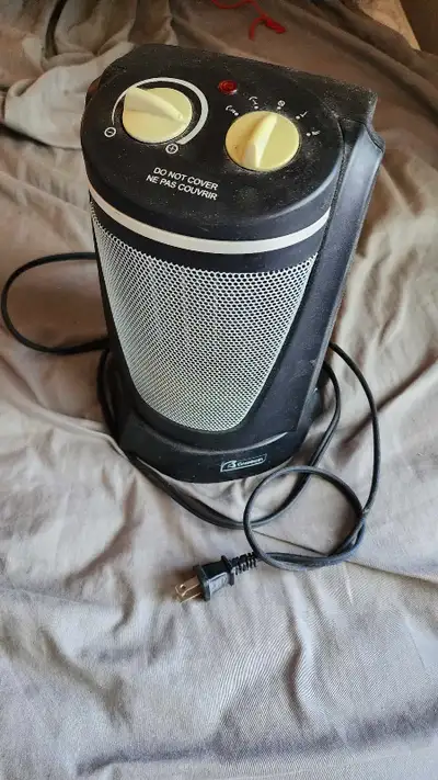 Chauffage Garrison Heater en excellent état, idéal pour réchauffer efficacement vos pièces pendant l...