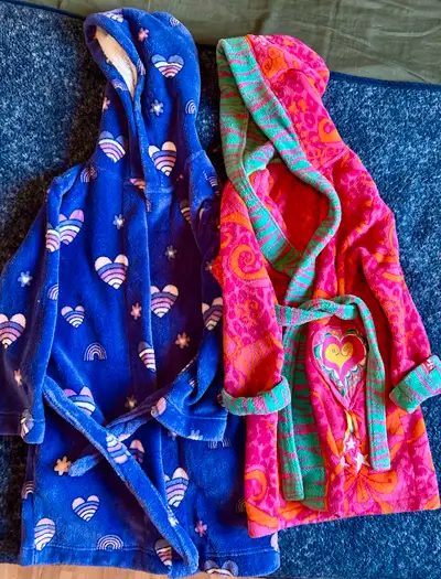 Two cute bathrobes for girls, size 7/8, very good condition. Bright colours and super soft material....