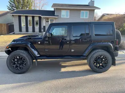 2016 Jeep Wrangler Sahara , after market hood, front bumper, lift kit , tire carrier , rims and tire...