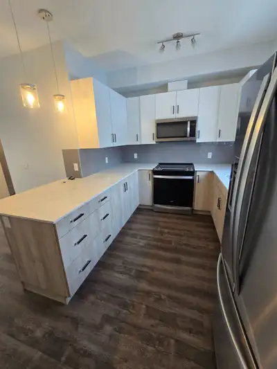 The main floor features a bright open-concept living room and impressive chef's kitchen, quartz coun...