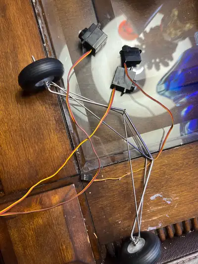 This is a used RC airplane landing gear set, including servos and wheels, ideal for model aircraft e...