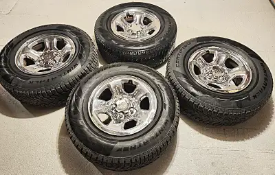 Ram 1500 winter tires on factory chrome rims. Driven 10,575 kilometers. 265/70/17. Seventeen inch OE...