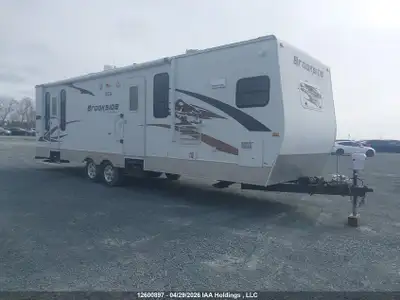 Selling my 2010 SunnyBrook 302FKS travel trailer. The trailer has significant roof damage and result...