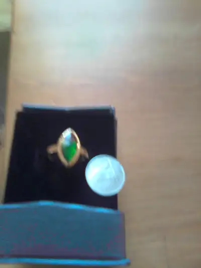 I have a size 6 faceted ammolite marquise ring in yellow gold plated .925 sterling silver. It is Alb...