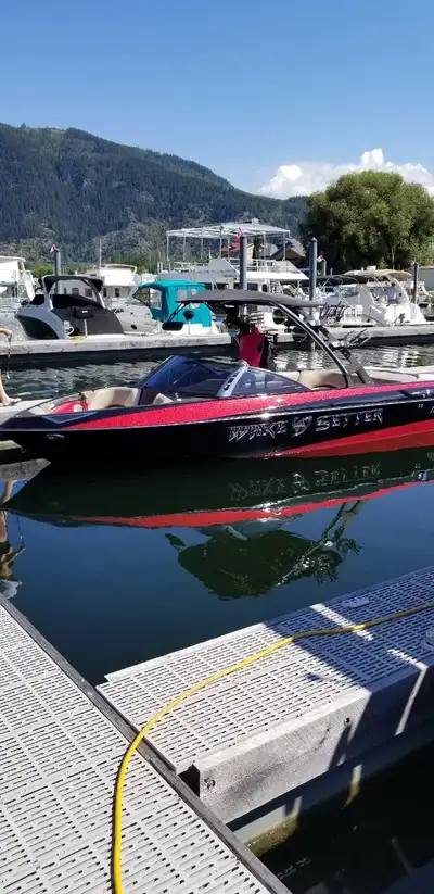 2012 Malibu Wakesetter and trailer located in Sicamous. Alberta registered trailer. 370.
