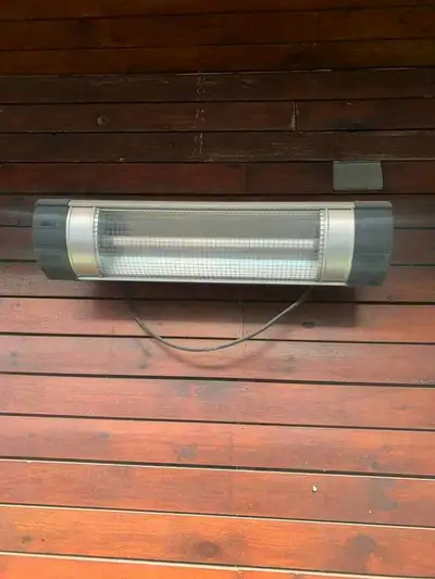 Stay cozy outdoors with this reliable wall-mounted infrared patio heater designed to keep you warm d...
