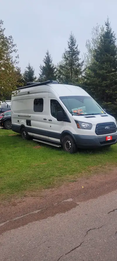 Converted camper van with awning, swivel seats,toilet and shower, full queen bed, under storage,prop...