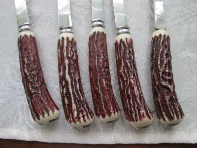 no loose handles, all are in solid condition, make an offer if interested, the one knife has a yello...