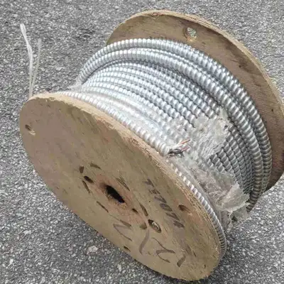 Near full roll of 12/2 armored wire. Wire roll weighs 32lbs.