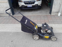 JUST SERVICED- Homelite lawn mower with bag.