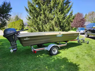 12" John Boat, like New. Still have the stickers, pedals, fishifinder, safety box, etc..8Hp Yamaha e...