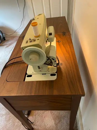 Vintage Singer sewing machine, View more