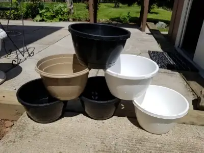 Lot of 6 10 Inch flower pots, View more