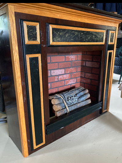 Custom built fireplace/mantle Has a an electric log display But would house a dimplex electric unit...