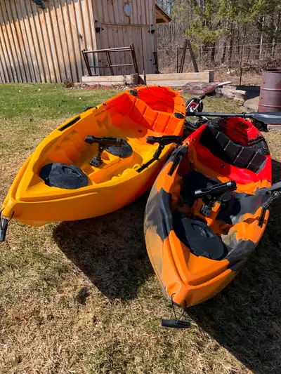 PAIR OF FISHING KAYAKS, BRAND NEW USED ONCE, COMES WITH A 2-WHEELED CART , AND STORAGE RACK (trailer...