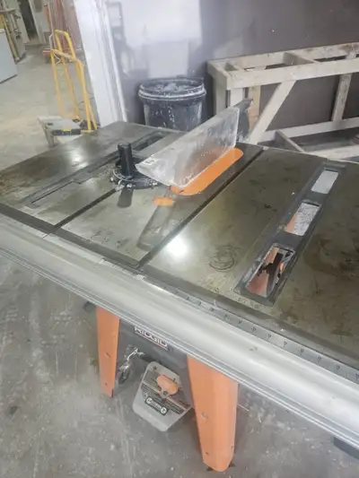 Large Rigid Table Saw with Wheels, very little use. Its heavy I can help you load it free of charge...