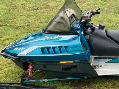1994 Polaris Trail Deluxe 488 fan snowmobile. Hand and thumb warm heated helmet plug has reverse and...