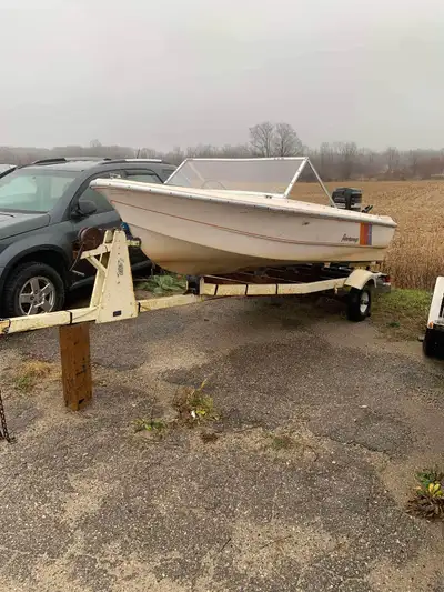 14ft Peterborough with 60 hp merc that runs good, trailer battery, gask tank and rod holders and bra...