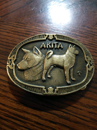 Solid brass Akita belt buckle, View more