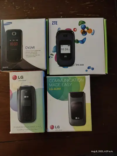 Four vintage flip phone's, View more