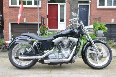 This one-of-a-kind, California-style 2000 Harley Dyna Super Glide is a beauty and a beast! Trimmed d...