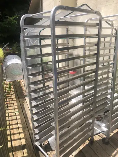 I'm selling a used aluminum bakery rack, perfect for organizing your kitchen or for use in a greenho...