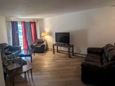Room for rent in Calgary SE condo building for July 1