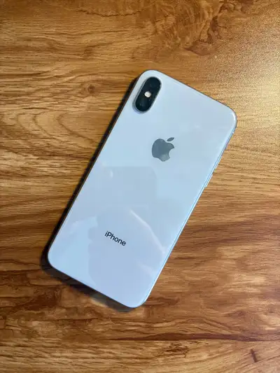 This pre-owned Apple iPhone X 64GB is in excellent condition, featuring a stunning edge-to-edge disp...