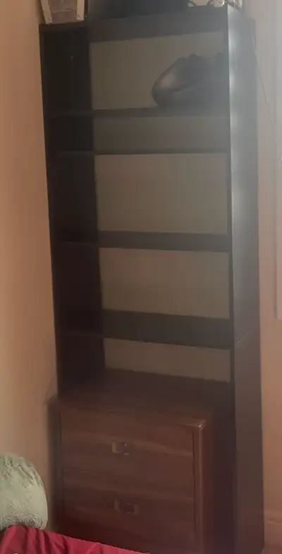Selling a black bookcase. It's in good condition and ready for a new home!