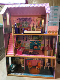 Pink wooden dollhouse