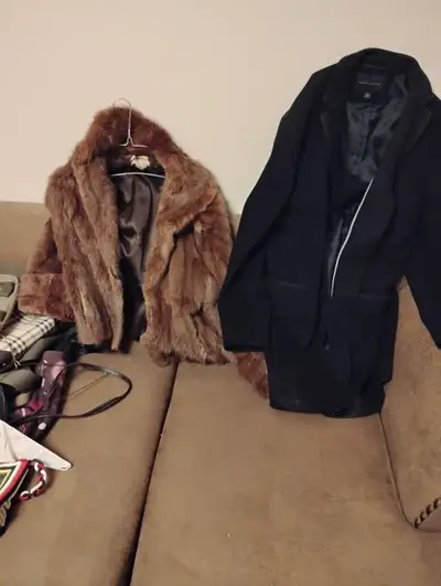 Men's pea coat and woman's fur coat., View more