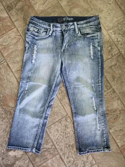Women's capri jeans for sale. Size 11. Distressed design. Blue colour. Gently worn - great condition...