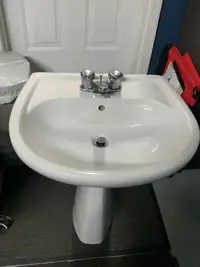 Pedestal sink with faucet