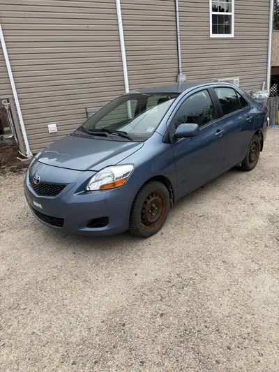 Yaris with 242,000km. Works and drives great. New front struts. Has winter and summer tires on rims....