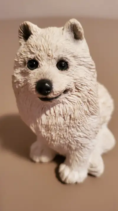 This happy little Samoyed dog (SC-163) is part of The Animal Collection of Stone Critters. The Unite...