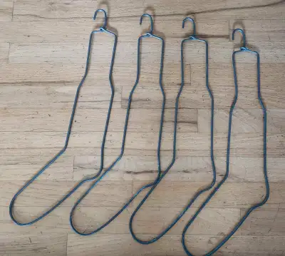 4 Vintage Heavy Metal Sock Forms, no rust, always stored inside. By the dryer...the hangars were use...